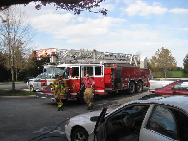 Firefighters Mike Nelson and Dave Terry at an appliance fire on Lauren Lane.